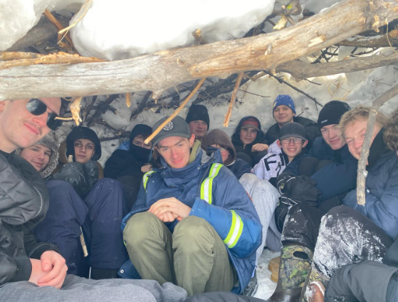 Class packed inside outdoor shelter